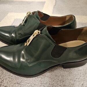 BCBGMaxAzria Dark Green Leather Loafers with Gold Accent